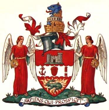 Illustration of the shield & crest of Dudley County with two winged figures flanking a crest with a dragon and castle on it, topped with a lion.