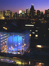 Hayden planetarium aerial view at night with New York City in the background