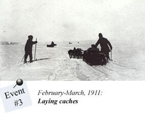 A black and white photograph that is dated February–March 1911 and labeled "Event #3: Laying caches". The picture shows a small group of people travelling through snow. On the left is a man who travels by sksi, on the right one man is handling the dogsled with a third man on skis next to him. A second group can be seen in the distance.
