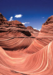 Photo of red rock formations against a deep blue sky