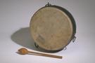A small round drum and a mallet against a white background.