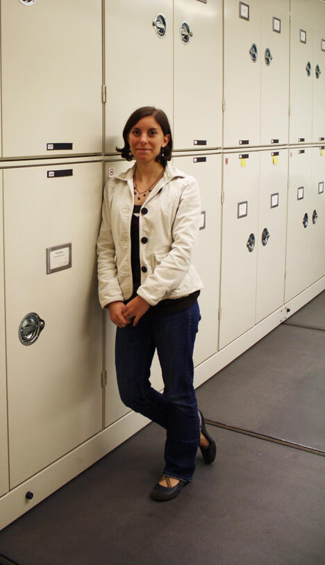 Woman at specimen lockers, paleontologist Eugenia Gold.