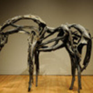 A metal sculpture of a horse.