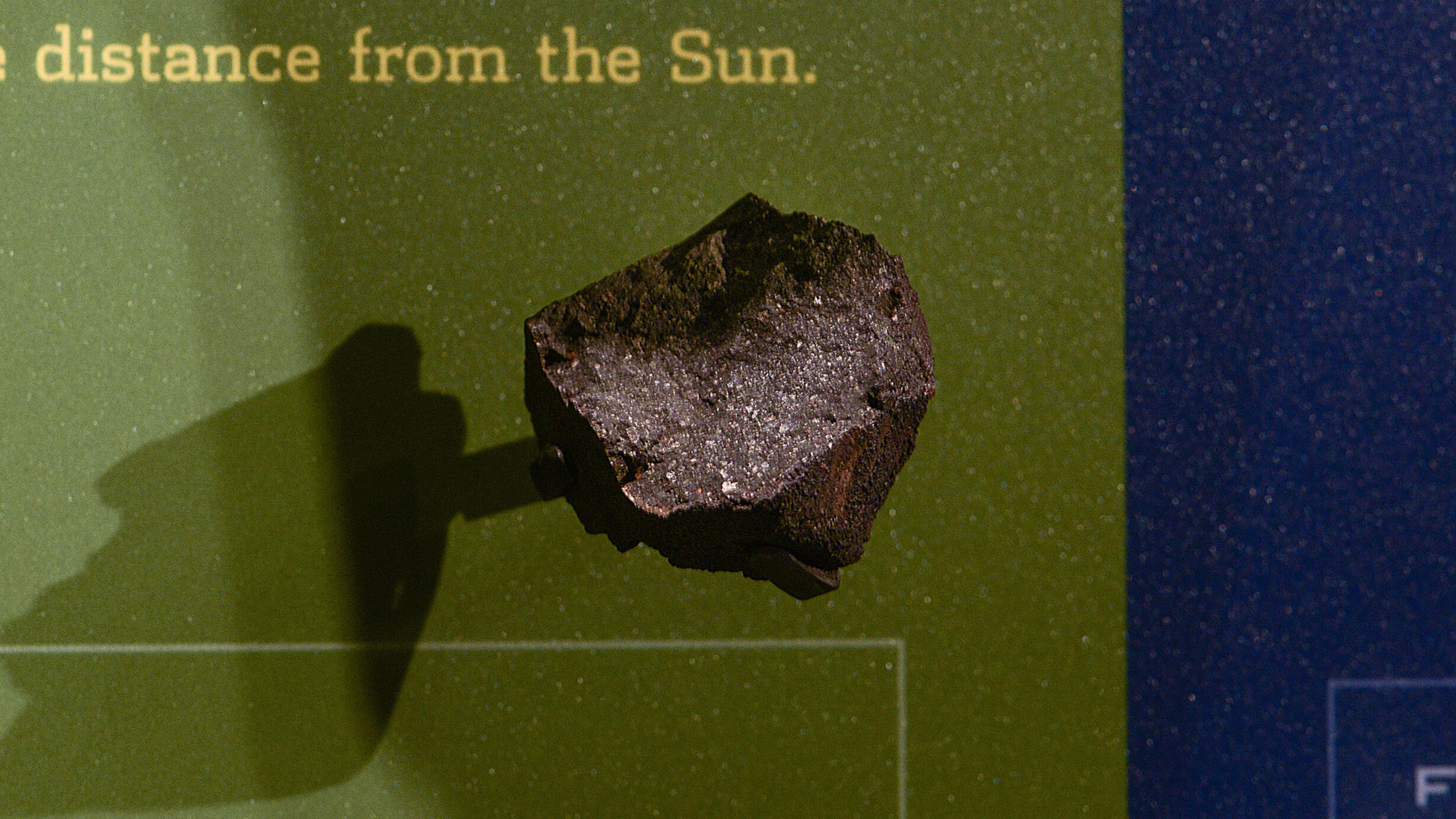 Meteorite specimen displayed in a case in the Hall of Meteorites.