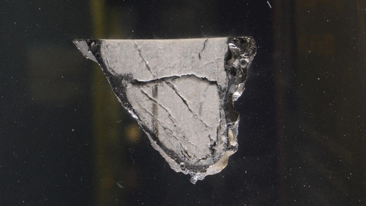 Slice of Anorthosite Breccia displayed in the Meteorites exhibit.