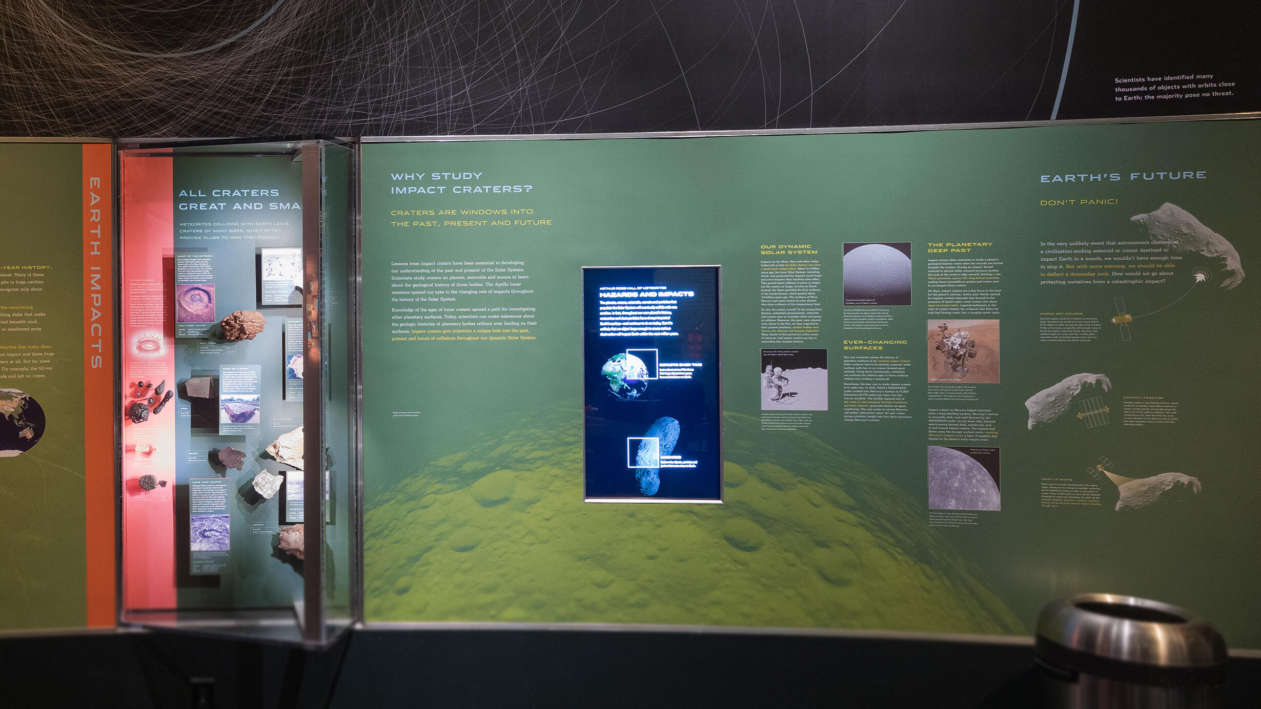 Earth Impacts section at the Hall of Meteorites showcasing meteorites and text.