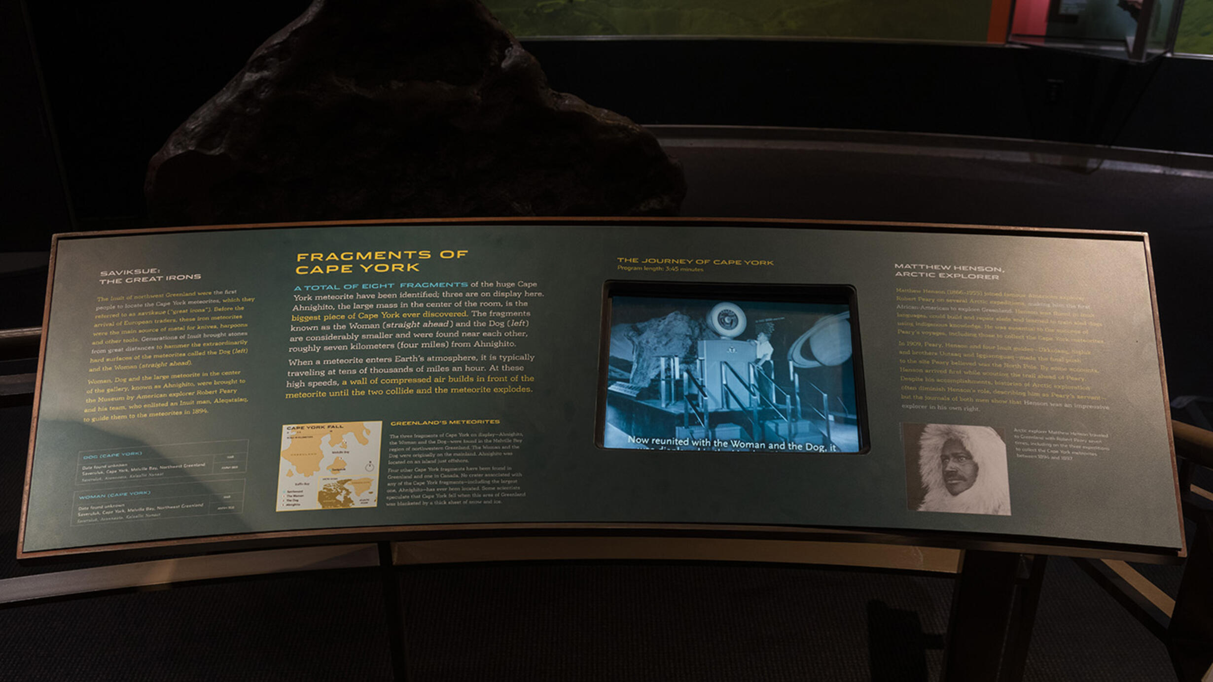 Museum label reading "Fragments of Cape York" with text about the eight fragments of the Cape York meteorite.