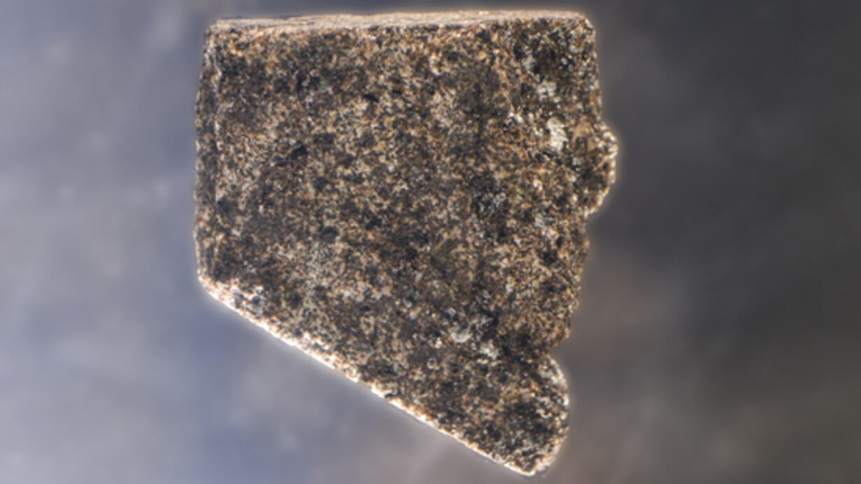 Mare basalt, a gray rock with specs suspended in glass