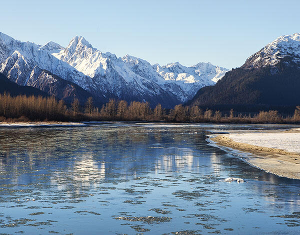 Snow-capped mountains border the Chilkat River.