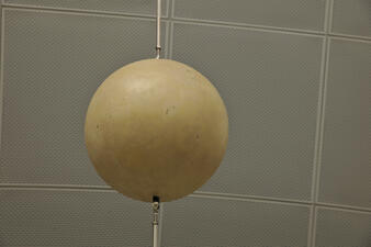 A suspended spherical model from an exhibit of stars and their sizes