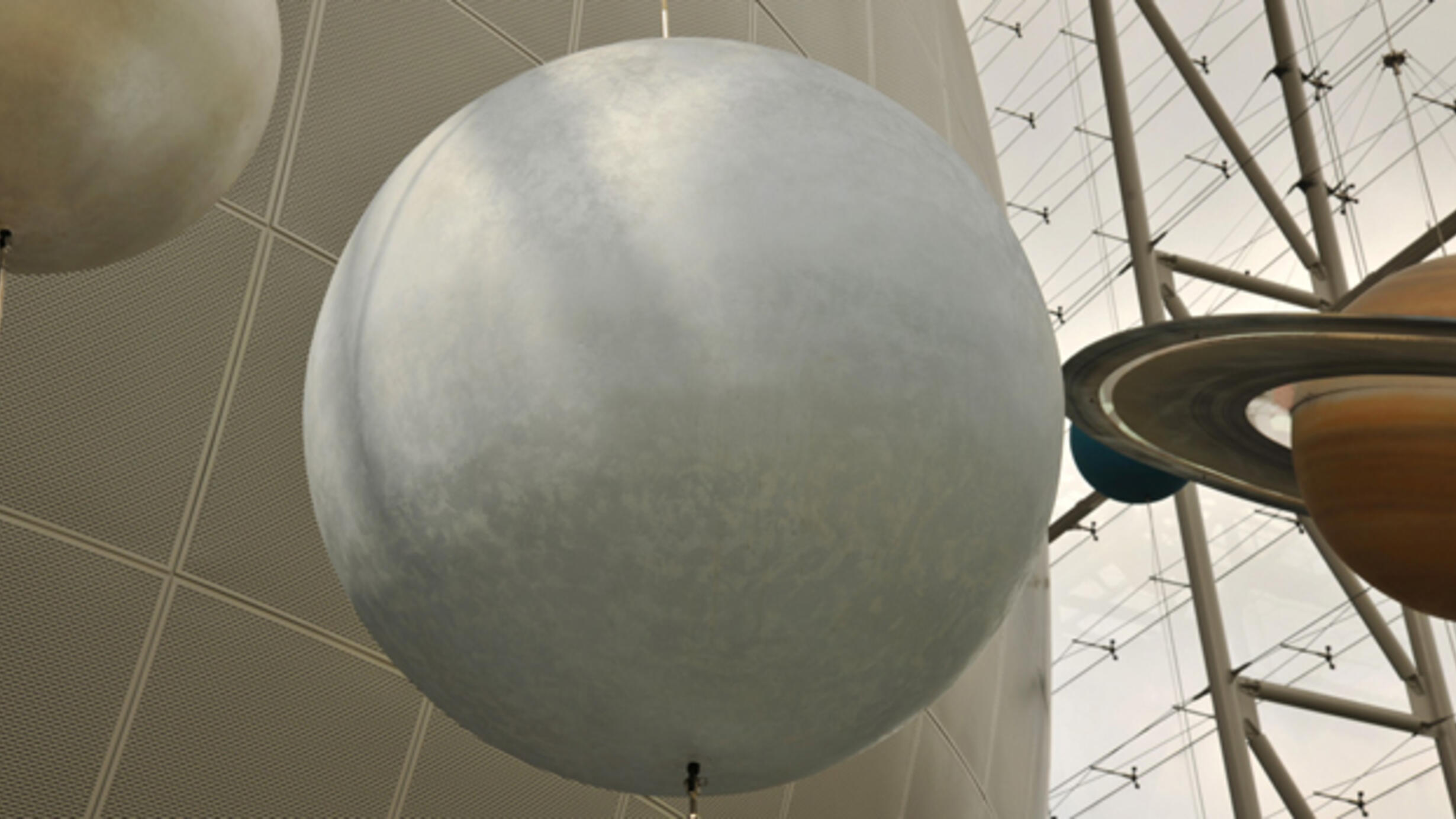 In the Rose Center for Earth and Space, a model of the star Vega, represented as smooth white sphere.