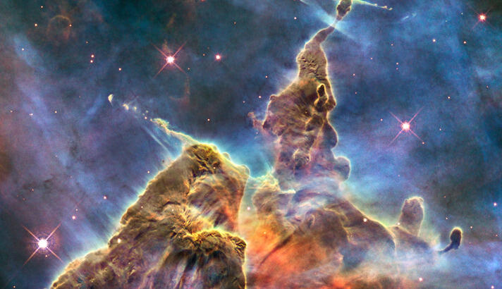 Colorized image of deep space, with dramatic formations..