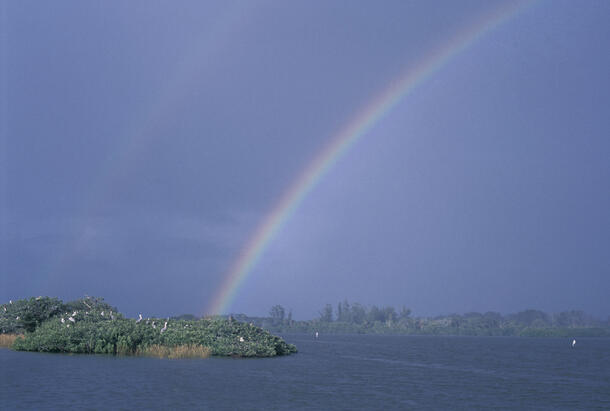 A double rainbow over Pelican Island and water