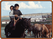 2 young Kazakhs on horse