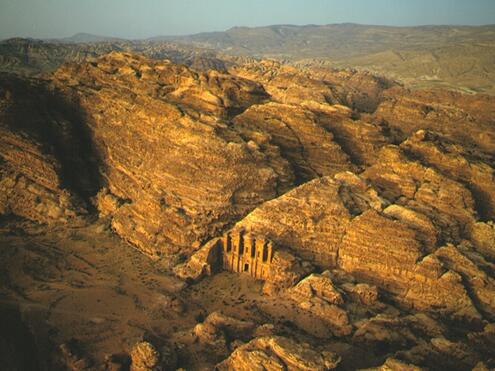 Aerial view Ed-Deir embedded in rock landscape