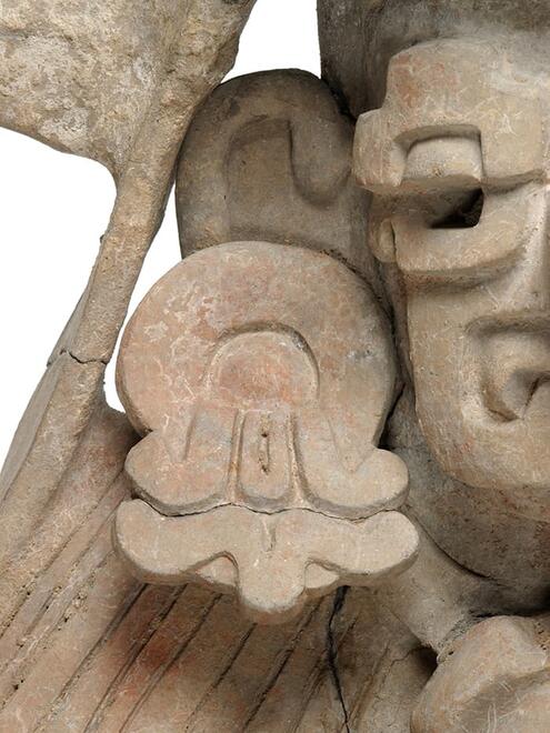 close up Zapotec urn's ear spool