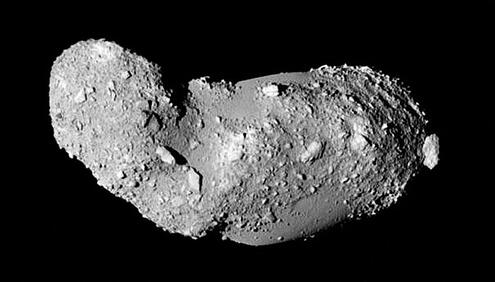 Oblong asteroid on black background