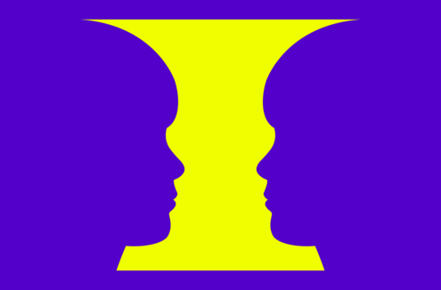 Yellow vase, with symmetrical curves on either side resembling the profile of a boy. 