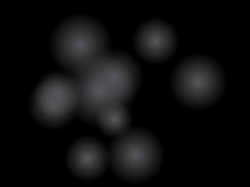 Seven blurred, light-colored circles floating against dark background.