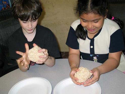 patting the Rice Krispie mixture into a round ball