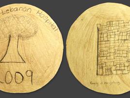 hand drawn coin with words Bronx Lebanon Hospital, a tree, and year 2009 on one side. A fort on the other side.