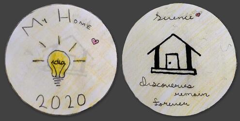 hand drawn coin with year 2020, a light bulb and words My Home on one side and the words Science Discoveries Remain Forever on the other side