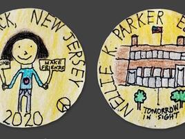 hand drawn coin with child holding signs that say Be Kind, Make Friends on one side and an elementary school one the other side