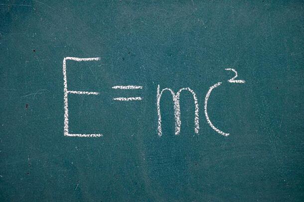 A chalkboard with "E=mc2" written on it in chalk.