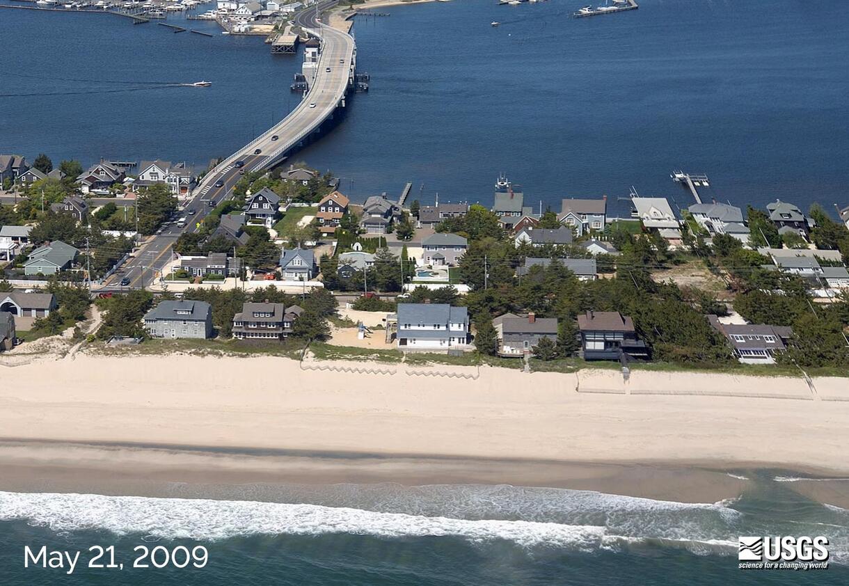 A May 21, 2009 photo of Mantoloking, New Jersey, showing intact homes, beach, and the Mantoloking Bridge connecting the town to the Jersey mainland.