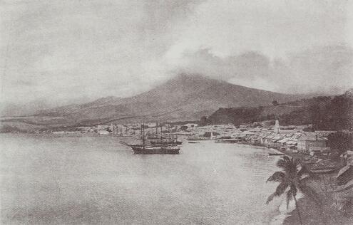 Vintage photo of the city of St. Pierre with Mt. Pelée in the distance.