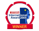 Circular seal with text "Firelli International Award 2005" in center over stylized illustration of person in profile and "WINNER" in banner below.