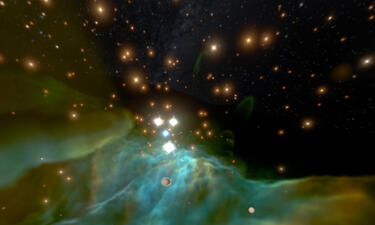 The orion nebula is pictured as huge clouds of turquoise green gases and thousands of stars