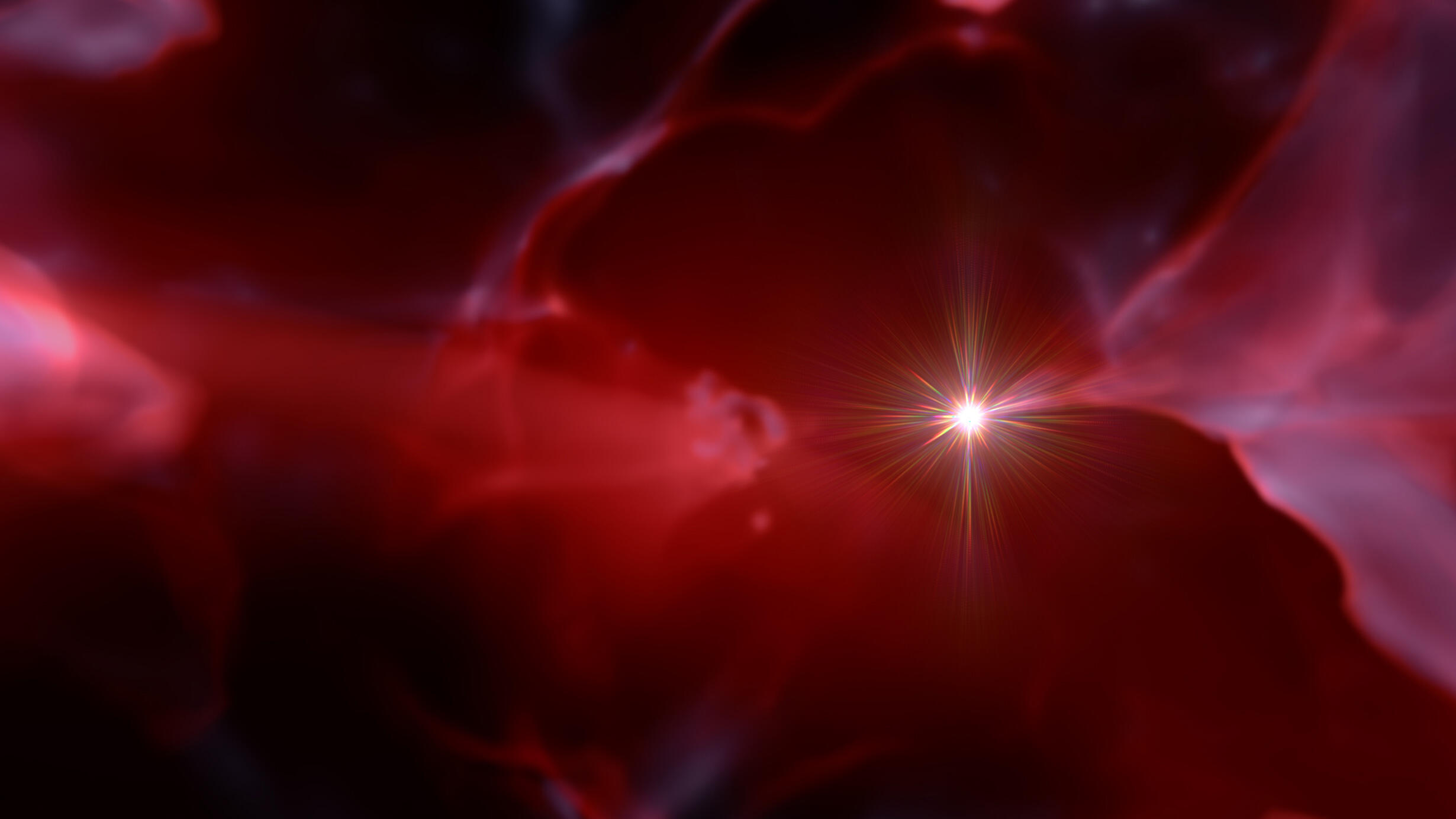 Red clouds of gas surrounding a star