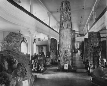 A Museum hall with enormous carved stone artifacts.