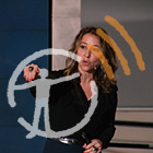 Janna Levin speaking with the AMNH podcast logo overlayed on top.