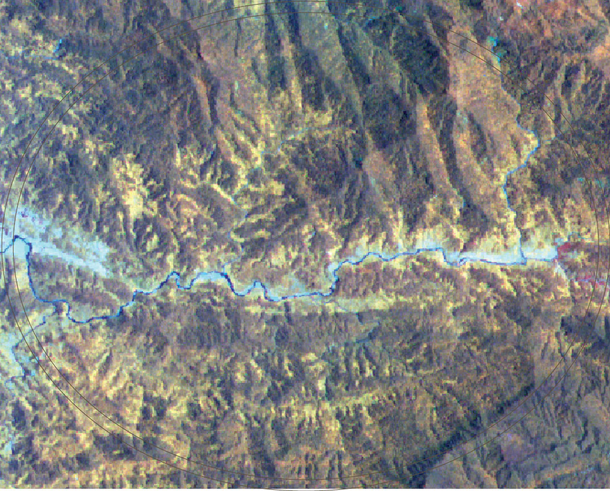 Satellite image of a rocky landscape with a river running through it.