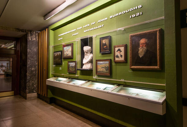 View of the John Burroughs corridor at the Museum, with Burroughs bust and portraits.