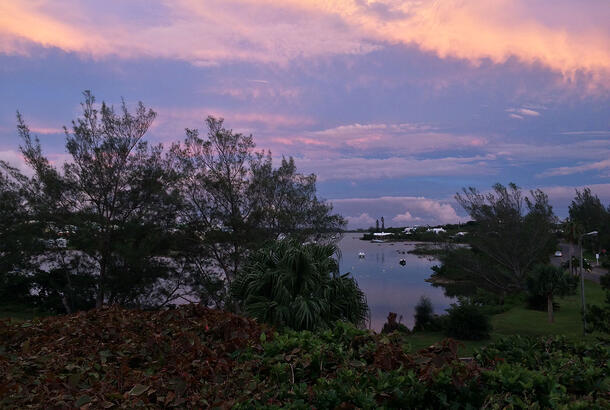 View from a hill of the sunset over the Ferry Reach channel.