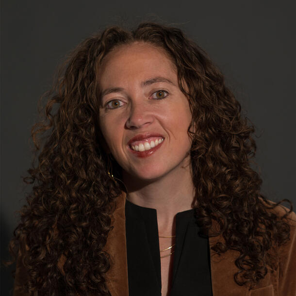 Headshot of woman with long hair.