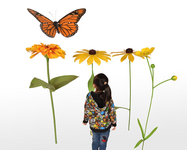 A child looks up at an oversized garden with flowers, a butterfly, and a bee. 