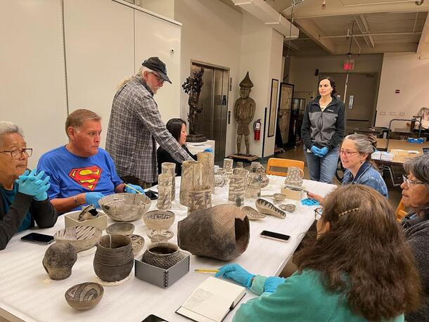 Potters, project consultants, and AMNH staff examining Southwestern pottery