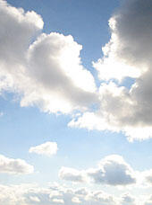 Cumulus clouds in a blue sky.