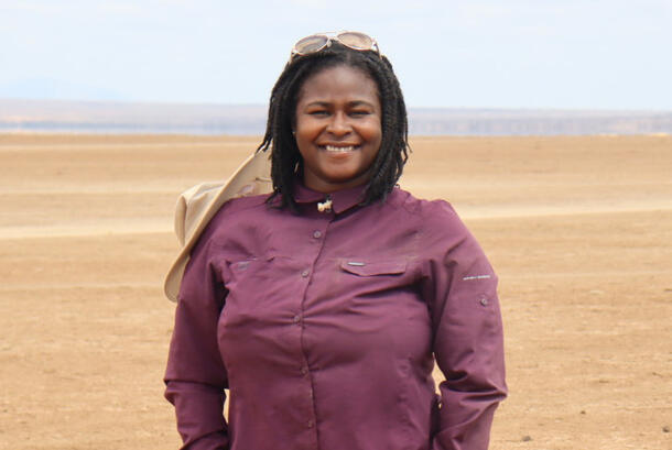 Environmental scientist Nyeema Harris, standing on a barren plateau in Amboseli National Park, in Kenya.