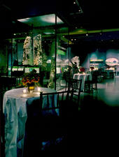 David S. and Ruth L. Gottesman Hall of Planet Earth at the American Museum of Natural History with tables and chairs for a cocktail celebration.