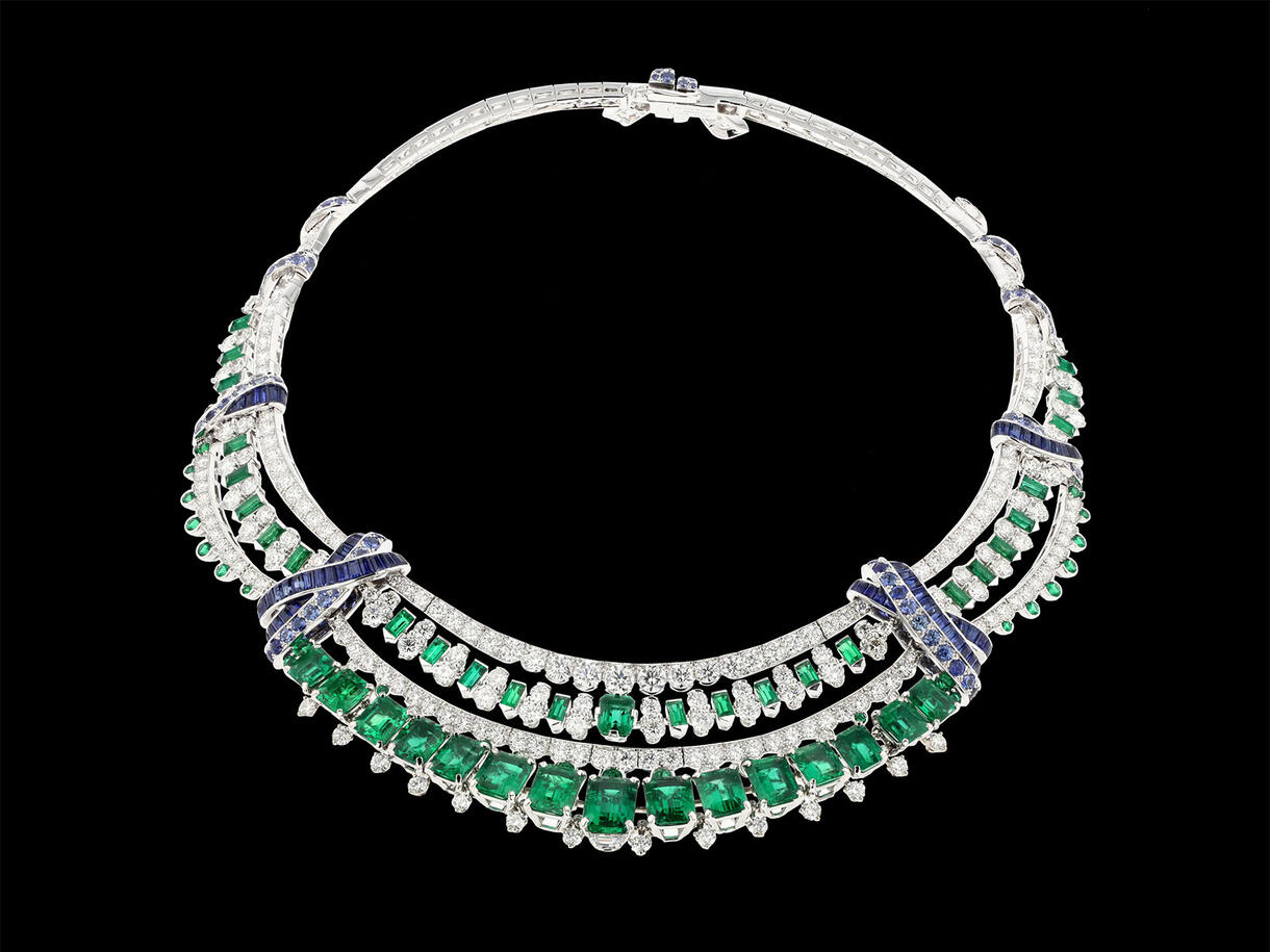 Choker-style necklace comprised of emeralds and diamonds.