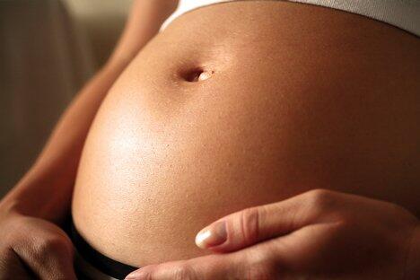 An exposed pregnant belly.
