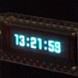 A digital clock showing the numbers 13:21:59.