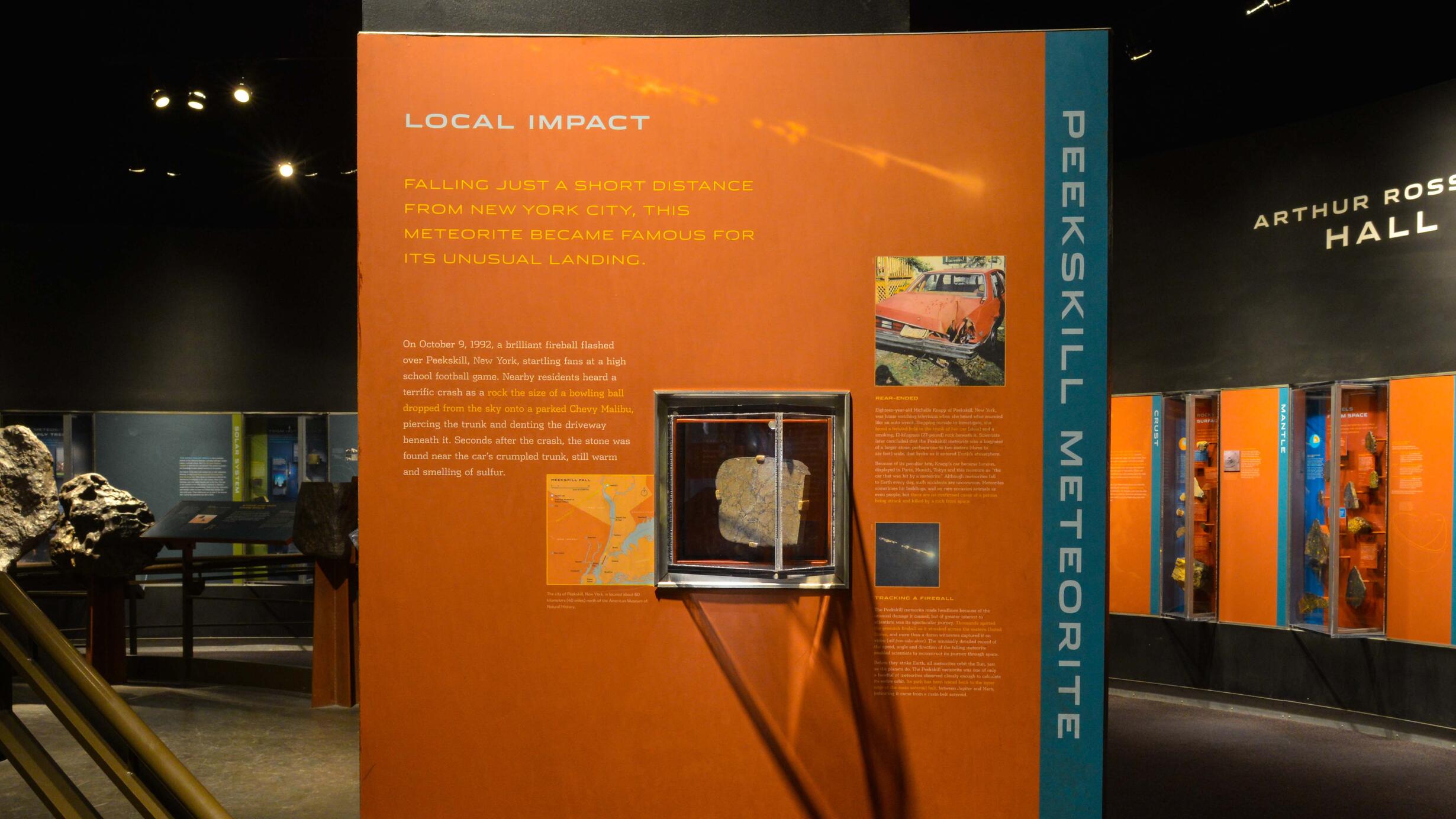 The Peekskill Meteorite in the Museum's Hall of Meteorites, on an information wall explaining the meteorite's fall in 1992.