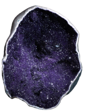Glittering amethyst crystals on the interior of a geode.