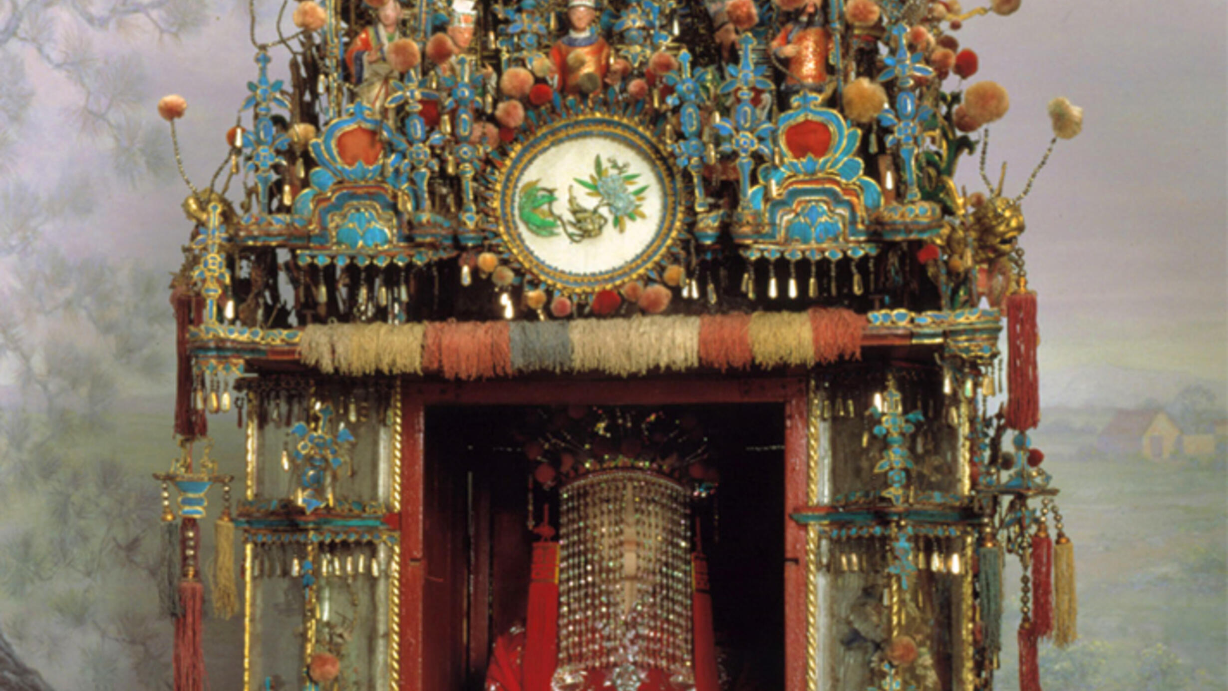 Upper part of elaborately decorated litter used to carry Chinese bride. The model seated inside wears beaded veil and costume.